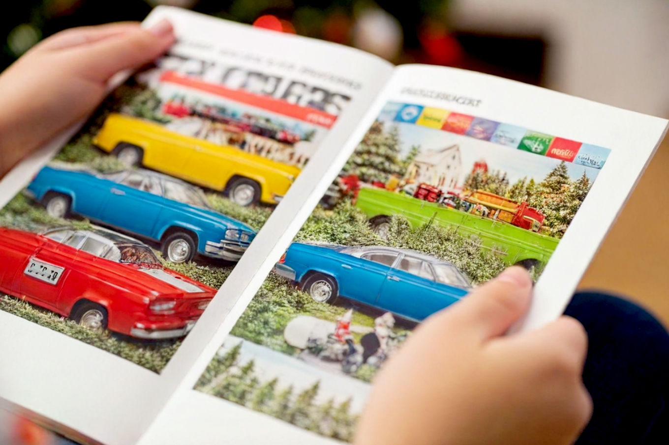 A close-up, lifelike professional photograph of a child's hands (around 8-10 years old) gently holding an open, slightly worn vintage Christmas toy catalog. The catalog pages are filled with colorful, vibrant images of various toys, depicted in a way that suggests classic playthings without needing precise detail. The focus is on the impression of a toy catalog, not specific items. Soft, warm Christmas lights are blurred in the background, creating a beautiful bokeh effect. The scene evokes a strong sense of nostalgia, wonder, and holiday anticipation. The lighting is warm and inviting, suggesting a cozy evening. Pro photography, shallow depth of field, high detail, golden hour, cozy atmosphere.