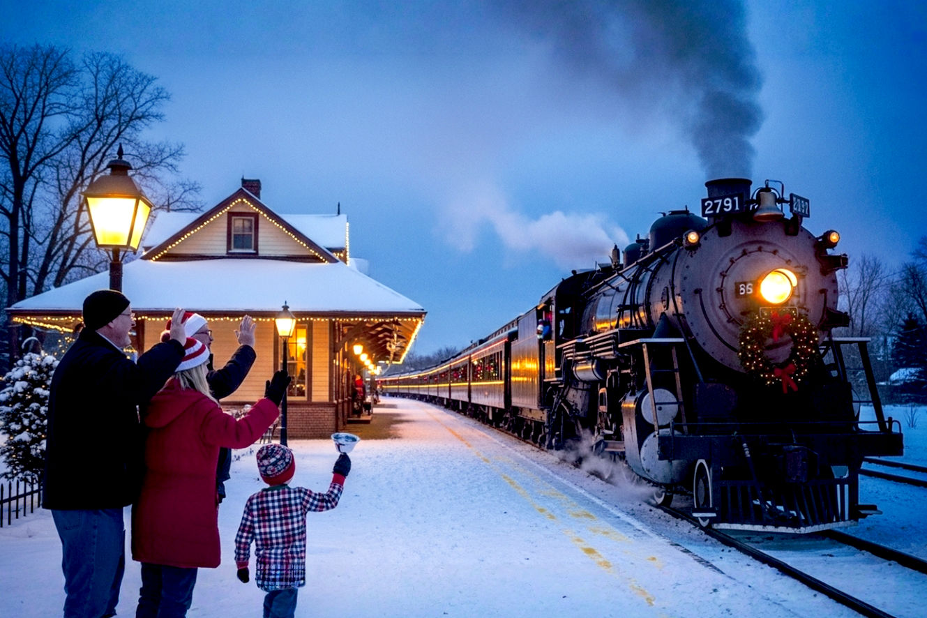 A highly detailed, lifelike, professional photograph capturing a classic Christmas Santa train ride at dusk. The scene is set in a snowy, picturesque landscape. A vintage steam locomotive, with a wreath on its front and brightly lit passenger cars behind it, is pulling away from a historic, festively decorated train station. In the foreground, a multi-generational family—a grandfather, a mother, and a young child in pajamas—stand on the platform, waving. The child is holding a silver sleigh bell. The lighting is warm and magical, with golden light spilling from the train's windows and station lanterns, contrasting with the cool blue tones of the snowy dusk. The mood is one of festive wonder, nostalgia, and cherished family tradition.